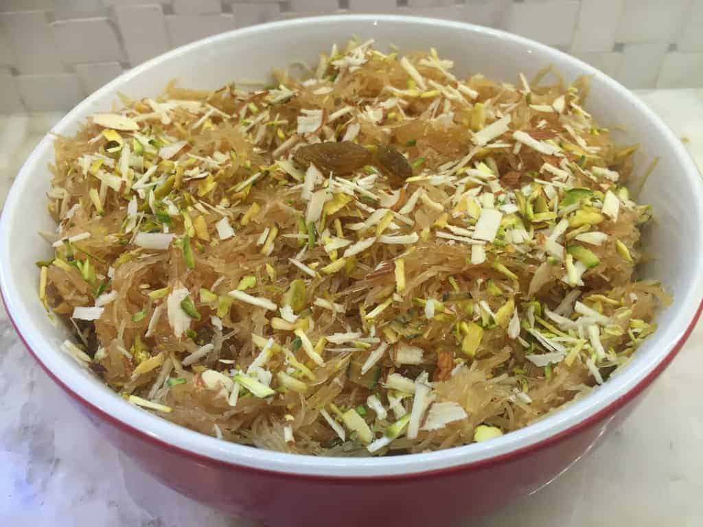 Vermicelli sheera in a bowl garnished with nuts and raisins 